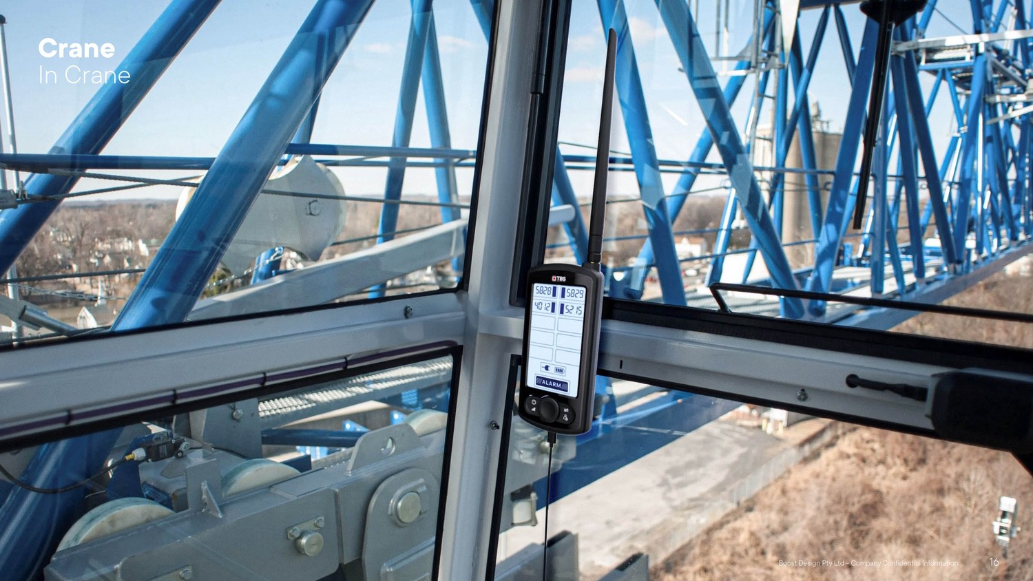 The Buddie System receiver mounted inside a blue lattice crane cab